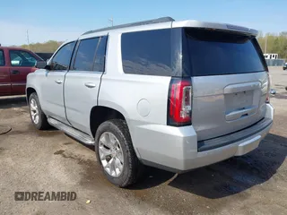 2015 GMC Yukon SLE with VIN 1GKS1AKC8FR540627, listed as a IAAI auction lot 42004023 with 128,195 mi miles. Bid and sale history available at carsss.com. Image 3.