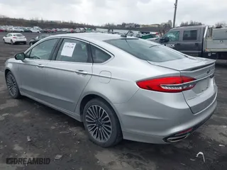 2018 Ford Fusion Titanium with VIN 3FA6P0D99JR139114, listed as a IAAI auction lot 41991248 with 142,324 mi miles. Bid and sale history available at carsss.com. Image 3.