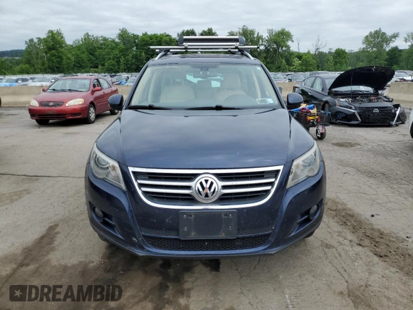 2011 Volkswagen Tiguan SEL z VIN WVGBV7AX2BW534482, wystawiony jako Copart lot #61097265 z przebiegiem 186 282 mil mil oraz Czysty tytuł • Clean title. Historia ofert i sprzedaży dostępna na DreamBid. Obrazek 5.