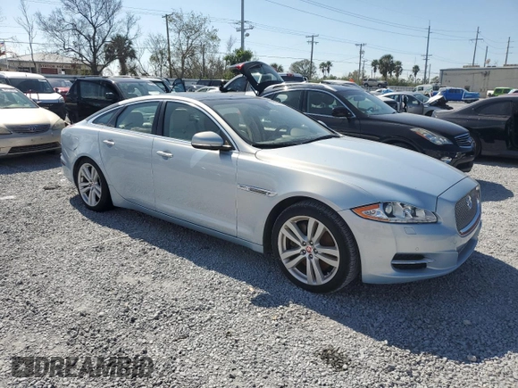 2014 Jaguar XJ with VIN SAJWA1CZ4E8V71167, listed as a Copart auction lot 43994545 with 69,682 mi miles and Salvage Title. Bid and sale history available at DreamBid. Image 4.