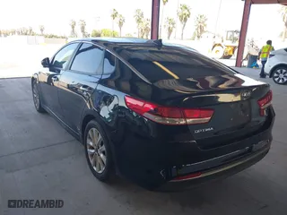 2016 Kia Optima LX with VIN 5XXGT4L33GG064125, listed as a IAAI auction lot 39506983 with 131,976 mi miles. Bid and sale history available at carsss.com. Image 3.