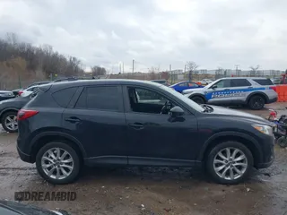 2014 Mazda CX-5 Grand Touring with VIN JM3KE4DY5E0373731, listed as a IAAI auction lot 41517852 with 148,414 mi miles. Bid and sale history available at carsss.com. Image 13.