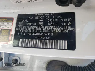 2023 Kia Rio S with VIN 3KPA24AD2PE579419, listed as a Copart auction lot 73399664 with 47,857 mi miles and Salvage Title. Bid and sale history available at DreamBid. Image 12.
