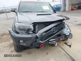2014 Toyota Tacoma z VIN 3TMMU4FN9EM066292, wystawiony jako IAAI lot #41542492 z przebiegiem 122 308 mil mil oraz . Historia ofert i sprzedaży dostępna na DreamBid. Obrazek 6.
