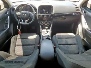 2014 Mazda CX-5 Touring with VIN JM3KE2CY5E0316077, listed as a Copart auction lot 58218735 with 190,789 mi miles and Salvage title. Bid and sale history available at DreamBid. Image 8.