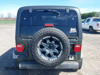 2006 Jeep Wrangler SE with VIN 1J4FA29116P763914, listed as a IAAI auction lot 42140140 with 107,161 mi miles. Bid and sale history available at carsss.com. Image 17.