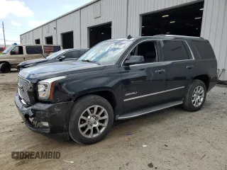 2015 GMC Yukon Denali with VIN 1GKS1CKJ0FR140877, listed as a Copart auction lot 50917985 with 180,726 mi miles and Salvage Title. Bid and sale history available at carsss.com. Image 1.