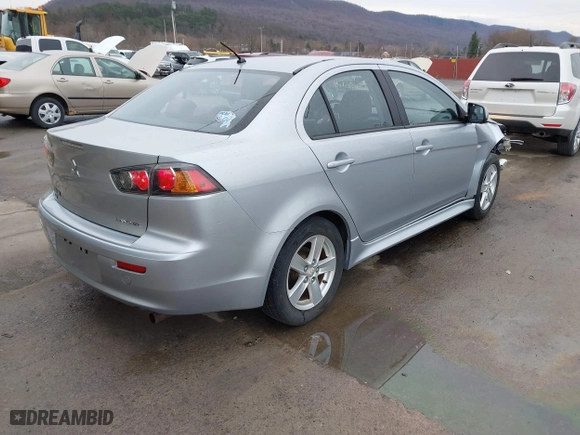 2013 Mitsubishi Lancer SE with VIN JA32V2FW7DU015061, listed as a IAAI auction lot 41863621 with 141,315 mi miles. Bid and sale history available at carsss.com. Image 4.