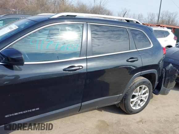 2015 Jeep Cherokee North with VIN 1C4PJMCS4FW792918, listed as a IAAI auction lot 41748651 with 107,034 mi miles. Bid and sale history available at carsss.com. Image 15.