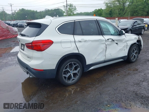 2018 BMW X1 xDrive28i with VIN WBXHT3C38J5L31322, listed as a IAAI auction lot 42260190 with 70,266 mi miles and . Bid and sale history available at DreamBid. Image 4.