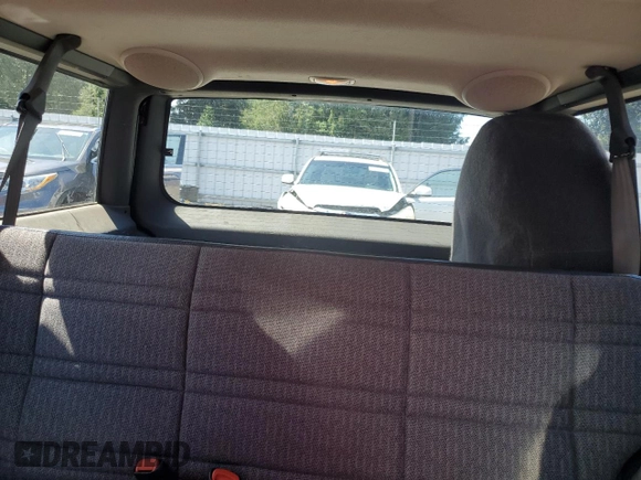 1999 Jeep Cherokee Sport z VIN 1J4FF68SXXL525944, wystawiony jako Copart lot #57653905 z przebiegiem 102 057 mil mil oraz Szkoda całkowita • Salvage title. Historia ofert i sprzedaży dostępna na DreamBid. Obrazek 10.