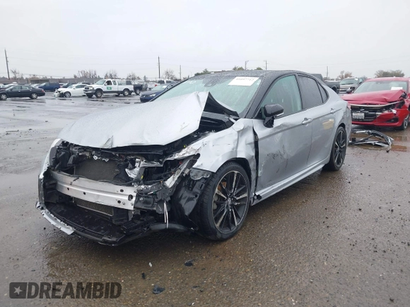 2020 Toyota Camry XSE with VIN 4T1K61AK1LU318098, listed as a IAAI auction lot 41097712 with 64,118 mi miles and . Bid and sale history available at DreamBid. Image 2.