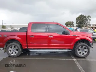 2015 Ford F-150 XLT with VIN 1FTEW1E89FFB76849, listed as a IAAI auction lot 41936016 with 107,773 mi miles and . Bid and sale history available at carsss.com. Image 14.