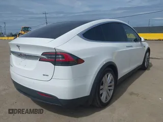 2016 Tesla Model X 70D with VIN 5YJXCBE24GF002020, listed as a IAAI auction lot 41799528 with 149,556 mi miles. Bid and sale history available at carsss.com. Image 4.