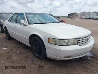 2004 Cadillac Seville Luxury SLS z VIN 1G6KS54YX4U151753, wystawiony jako IAAI lot #42061374 z przebiegiem 141 879 mil mil oraz . Historia ofert i sprzedaży dostępna na DreamBid. Obrazek 1.