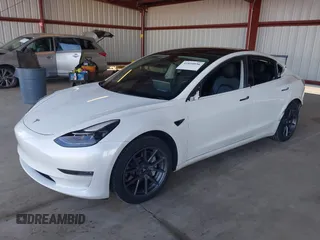 2021 Tesla Model 3 Long Range with VIN 5YJ3E1EB3MF003027, listed as a IAAI auction lot 41859036 with 102,302 mi miles and . Bid and sale history available at carsss.com. Image 2.