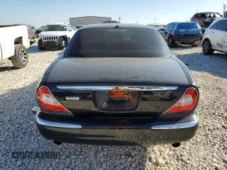 2006 Jaguar XJ with VIN SAJWA79B66SH07528, listed as a Copart auction lot 80396994 with 114,922 mi miles and Clean Title. Bid and sale history available at carsss.com. Image 6.