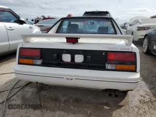 1986 Toyota MR2 z VIN JT2AW15C7G0083196, wystawiony jako Copart lot #74149374 z przebiegiem 30 771 mil mil oraz Nie do naprawy. Historia ofert i sprzedaży dostępna na DreamBid. Obrazek 6.