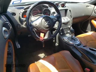 2014 Nissan 370Z Nismo with VIN JN1AZ4EH7EM633324, listed as a Copart auction lot 53812335 with 57,856 mi miles and Salvage Title. Bid and sale history available at DreamBid. Image 8.