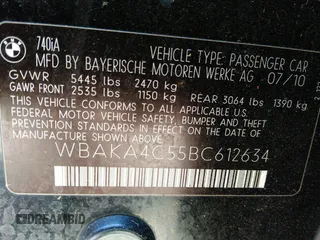 2011 BMW 7 Series 740i with VIN WBAKA4C55BC612634, listed as a IAAI auction lot 35404385 with 156,003 mi miles. Bid and sale history available at carsss.com. Image 9.