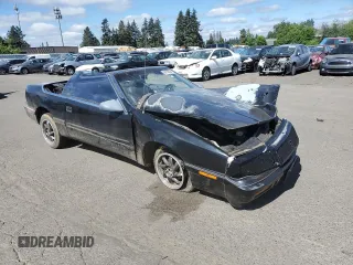 1992 Chrysler LeBaron z VIN 1C3XU4537NF129794, wystawiony jako Copart lot #71594804 z przebiegiem 156 624 mil mil oraz Szkody całkowita. Historia ofert i sprzedaży dostępna na DreamBid. Obrazek 4.