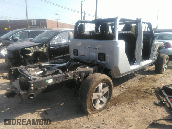 2022 Jeep Gladiator Willys with VIN 1C6HJTAG0NL131004, listed as a IAAI auction lot 40307060 with Not provided miles and . Bid and sale history available at DreamBid. Image 4.