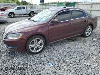 2014 Volkswagen Passat SE with VIN 1VWBN7A31EC069830, listed as a Copart auction lot 57675005 with 157,726 mi miles and Salvage title. Bid and sale history available at DreamBid. Image 1.