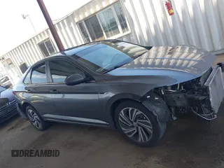 2021 Volkswagen Jetta SEL z VIN 3VWE57BU3MM032442, wystawiony jako IAAI lot #42404802 z przebiegiem 32 927 mil mil oraz . Historia ofert i sprzedaży dostępna na DreamBid. Obrazek 14.