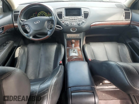 2005 Infiniti Q45 z VIN JNKBF01A45M100941, wystawiony jako Copart lot #71366494 z przebiegiem 117 616 mil mil oraz Czysty tytuł • Clean title. Historia ofert i sprzedaży dostępna na DreamBid. Obrazek 8.