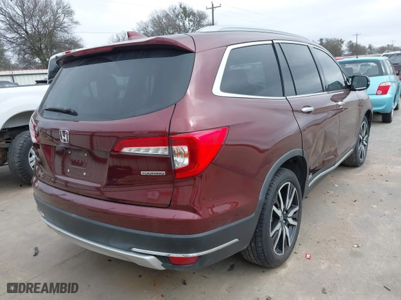 2019 Honda Pilot Touring 8-Passenger with VIN 5FNYF5H95KB009122, listed as a IAAI auction lot 41573338 with 85,845 mi miles. Bid and sale history available at carsss.com. Image 4.