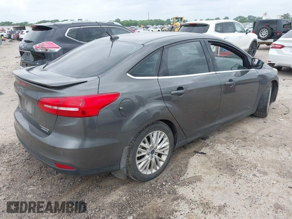 2016 Ford Focus Titanium z VIN 1FADP3J21GL260145, wystawiony jako IAAI lot #42137319 z przebiegiem 131 835 mil mil oraz . Historia ofert i sprzedaży dostępna na DreamBid. Obrazek 4.