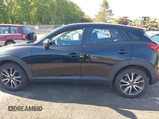 2018 Mazda CX-3 Touring z VIN JM1DKFC73J0321605, wystawiony jako IAAI lot #42355269 z przebiegiem 40 053 mil mil oraz . Historia ofert i sprzedaży dostępna na DreamBid. Obrazek 14.