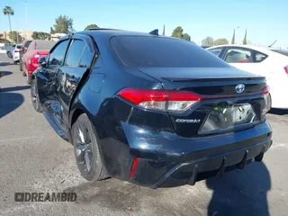 2023 Toyota Corolla Hybrid LE with VIN JTDBCMFE6P3001785, listed as a IAAI auction lot 41337266 with 25,829 mi miles. Bid and sale history available at carsss.com. Image 3.