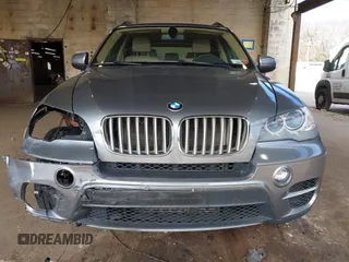 2012 BMW X5 35d with VIN 5UXZW0C59CL673416, listed as a IAAI auction lot 41910233 with 70,008 mi miles and . Bid and sale history available at DreamBid. Image 12.
