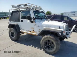 1999 Jeep Wrangler Sport with VIN 1J4FY19SXXP464096, listed as a Copart auction lot 61233105 with 167,350 mi miles and Clean title. Bid and sale history available at DreamBid. Image 4.