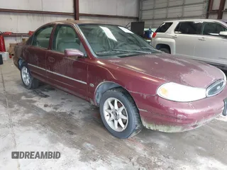 1999 Ford Contour SE z VIN 1FAFP6639XK144984, wystawiony jako IAAI lot #42363538 z przebiegiem 160 891 mil mil oraz . Historia ofert i sprzedaży dostępna na DreamBid. Obrazek 1.