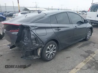 2021 Toyota Prius LE with VIN JTDKAMFP4M3194053, listed as a IAAI auction lot 42441091 with 47,290 mi miles and . Bid and sale history available at DreamBid. Image 4.