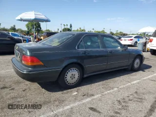 1996 Acura RL with VIN JH4KA965XTC009917, listed as a Copart auction lot 65083665 with 197,486 mi miles and Salvage title. Bid and sale history available at DreamBid. Image 3.