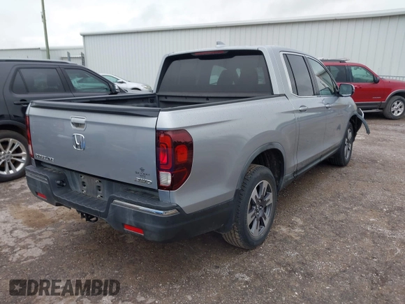 2018 Honda Ridgeline RTL with VIN 5FPYK3F52JB002649, listed as a IAAI auction lot 42338360 with 68,802 mi miles and . Bid and sale history available at DreamBid. Image 4.