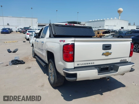 2014 Chevrolet Silverado 1500 High Country with VIN 3GCUKTEC4EG409072, listed as a IAAI auction lot 41986843 with 124,058 mi miles. Bid and sale history available at carsss.com. Image 3.