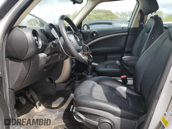 2015 MINI Countryman with VIN WMWZB3C52FWM33204, listed as a Copart auction lot 51680405 with 154,839 mi miles and Salvage Title. Bid and sale history available at DreamBid. Image 7.