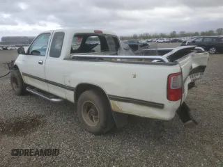 1995 Toyota T100 DX z VIN JT4VD12E5S0002399, wystawiony jako Copart lot #50703005 z przebiegiem 381 083 mil mil oraz Szkody całkowita. Historia ofert i sprzedaży dostępna na DreamBid. Obrazek 2.
