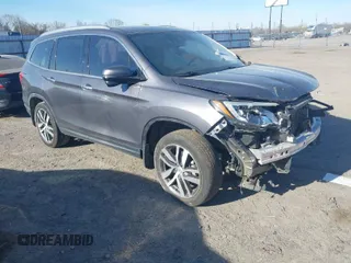 2017 Honda Pilot Touring with VIN 5FNYF5H97HB023919, listed as a IAAI auction lot 41864959 with 70,360 mi miles. Bid and sale history available at carsss.com. Image 1.