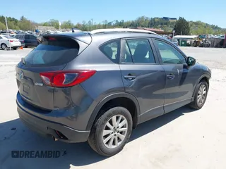 2016 Mazda CX-5 Sport with VIN JM3KE2BY2G0781565, listed as a IAAI auction lot 42042256 with 182,186 mi miles. Bid and sale history available at carsss.com. Image 4.