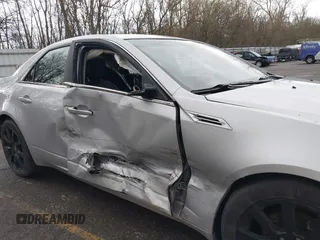 2009 Cadillac CTS AWD z VIN 1G6DH577X90135559, wystawiony jako IAAI lot #42077850 z przebiegiem 175 345 mil mil oraz . Historia ofert i sprzedaży dostępna na DreamBid. Obrazek 6.