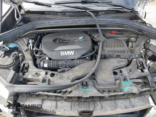 2018 BMW X1 sDrive28i with VIN WBXHU7C38J5L05985, listed as a IAAI auction lot 42014649 with 77,082 mi miles. Bid and sale history available at carsss.com. Image 10.