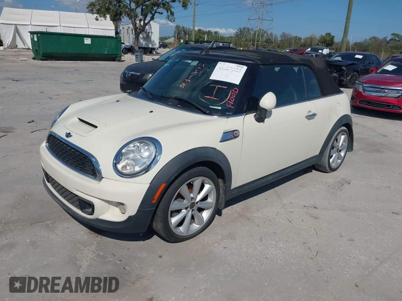 2013 MINI Convertible S with VIN WMWZP3C51DT297843, listed as a IAAI auction lot 41527353 with 127,827 mi miles and . Bid and sale history available at DreamBid. Image 2.