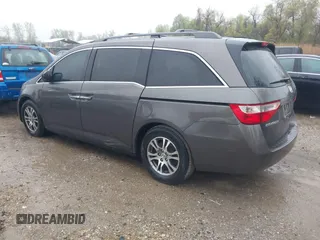 2012 Honda Odyssey EX-L with VIN 5FNRL5H6XCB057557, listed as a IAAI auction lot 42022410 with 174,286 mi miles and . Bid and sale history available at DreamBid. Image 3.