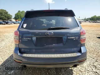 2014 Subaru Forester XT Touring with VIN JF2SJGPC0EH491792, listed as a Copart auction lot 61949315 with 126,304 mi miles and Salvage title. Bid and sale history available at DreamBid. Image 6.