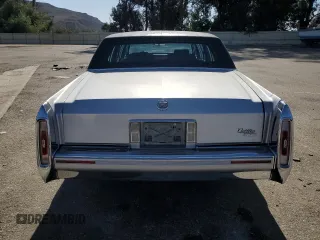 1992 Cadillac Brougham z VIN 1G6DW5474NR713140, wystawiony jako Copart lot #76990784 z przebiegiem 63 153 mil mil oraz Tytuł czysty. Historia ofert i sprzedaży dostępna na DreamBid. Obrazek 6.